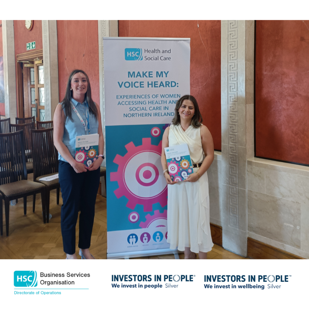 Claire Hamilton (Head of BSO Interpreting Service) standing with Bronagh Mahon (Leadership Centre) in front of a pull-up banners