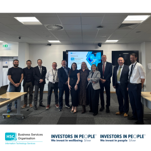 Group photograph of BSO Information Technology Services staff, the Permanent Secretary to the Department of Health and senior representatives from partner organisations during a visit to James House. The visit highlighted the digital services and support ITS provides to Health and Social Care across Northern Ireland.
