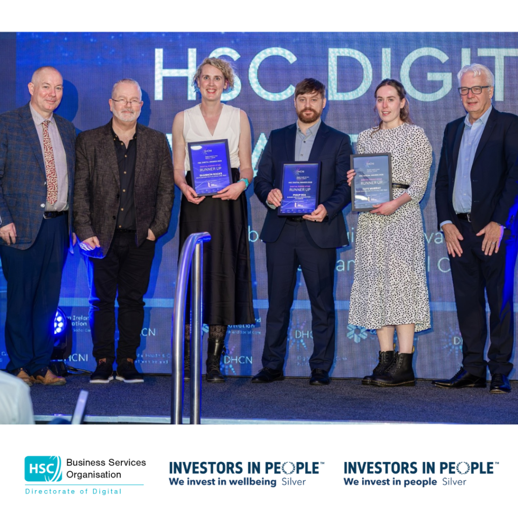Group photograph on an awards stage showing three Digital Rising Star Award runners-up holding framed certificates, flanked by award presenters. HSC Digital Awards branding is displayed in the background, with HSC Business Services Organisation and Investors in People Silver logos below.
